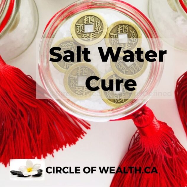 A traditional Feng Shui Salt Water Cure in a glass bowl with coarse salt, six Chinese coins, and water, placed in the Northeast corner of a home to neutralize negative energy.